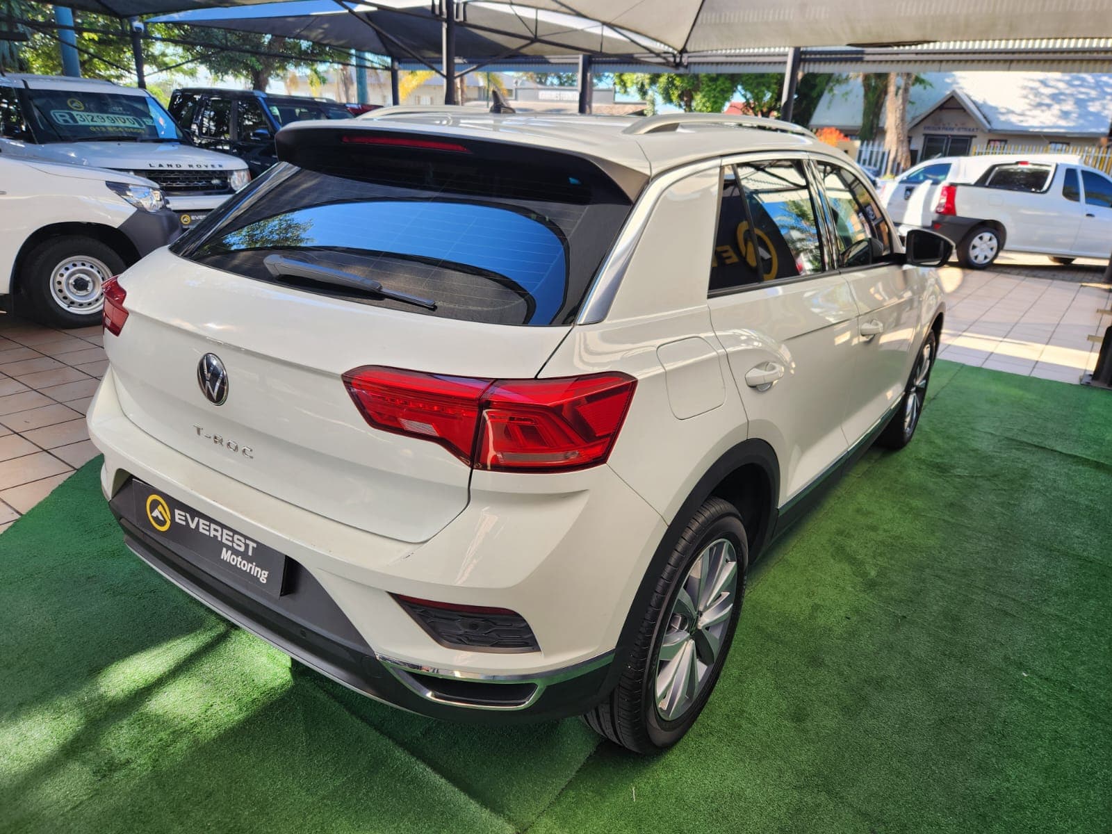Full rear exterior view of the white 2021 Volkswagen T-Roc 1.4 TSI Design Auto, showcasing the tailgate.