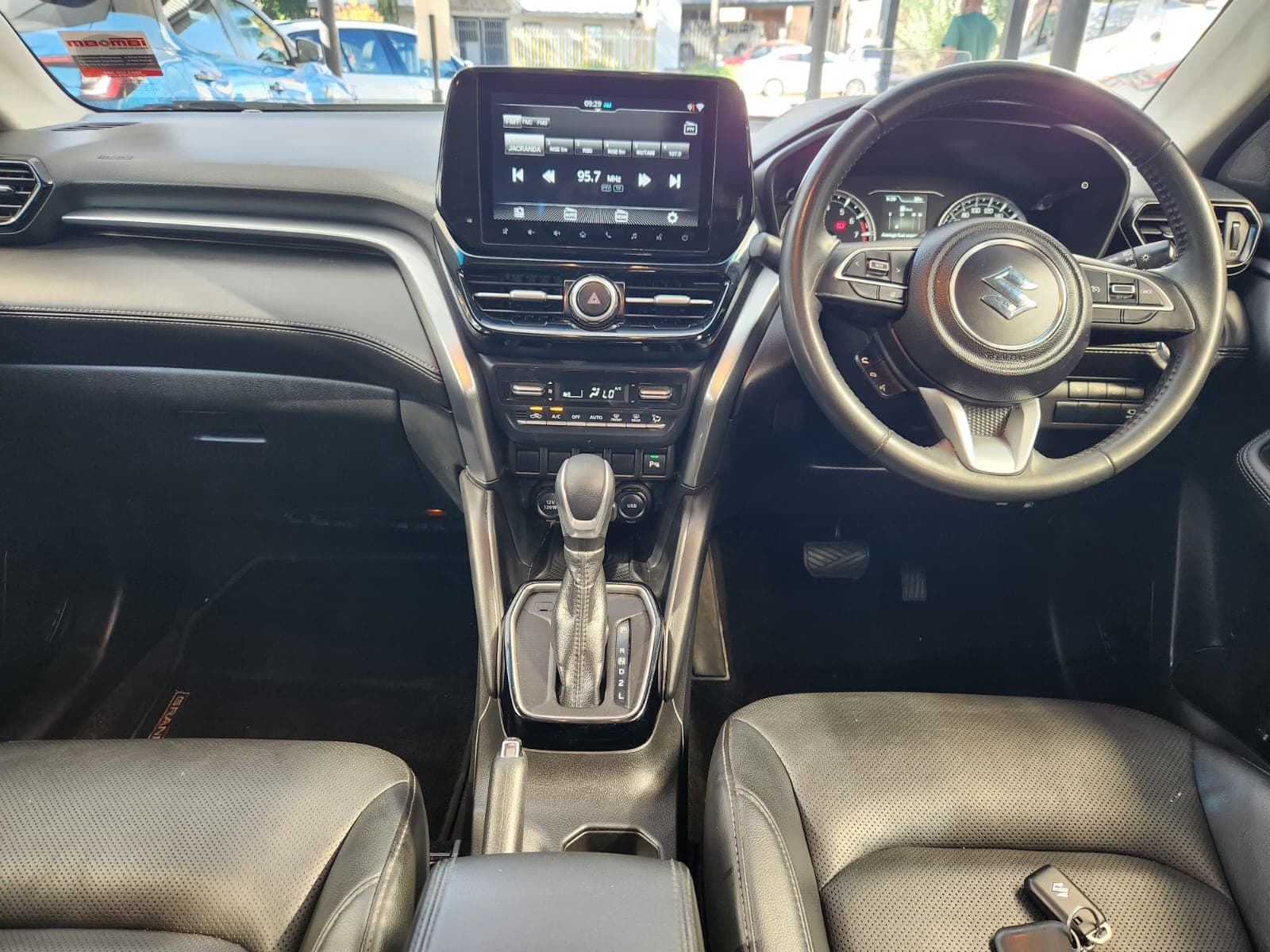 Interior view of the 2024 Suzuki Grand Vitara 1.5 GLX Auto, showing dashboard and centre console.