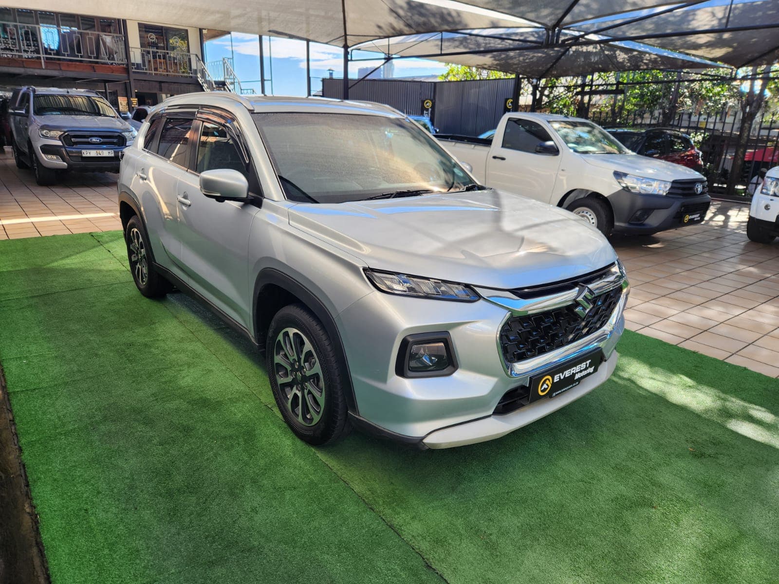 Silver 2024 Suzuki Grand Vitara 1.5 GLX Auto, front three-quarter view on display in White River.