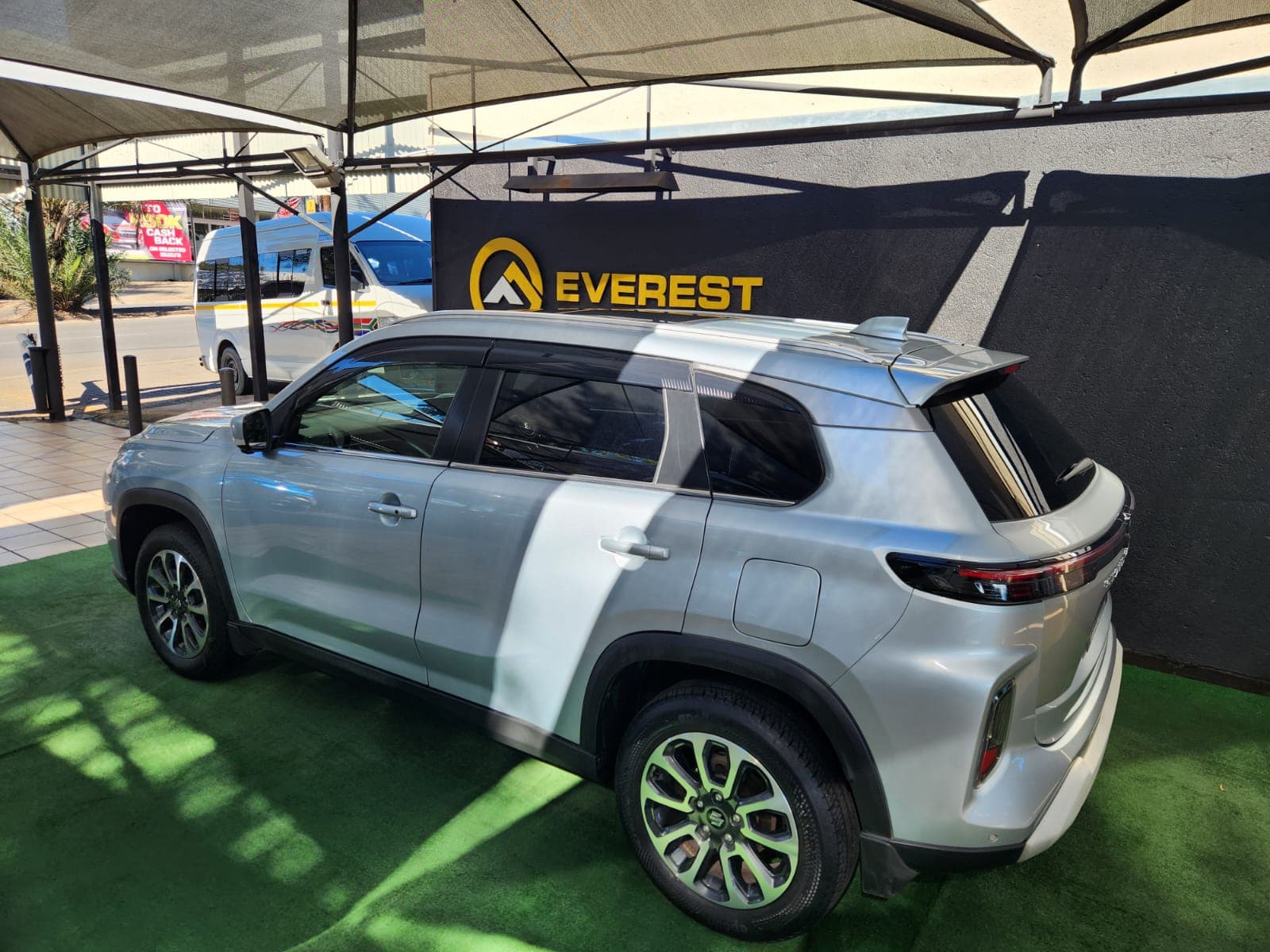 Rear three-quarter exterior view of the silver 2024 Suzuki Grand Vitara 1.5 GLX Auto.