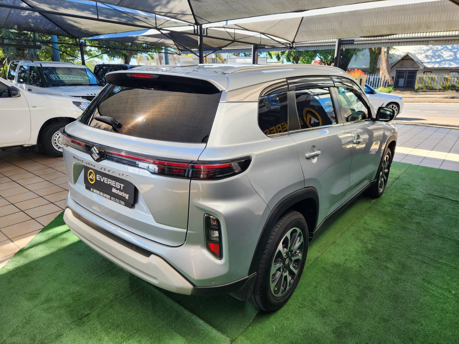 View of the engine bay in the 2024 Suzuki Grand Vitara 1.5 GLX Auto, showcasing its petrol engine.
