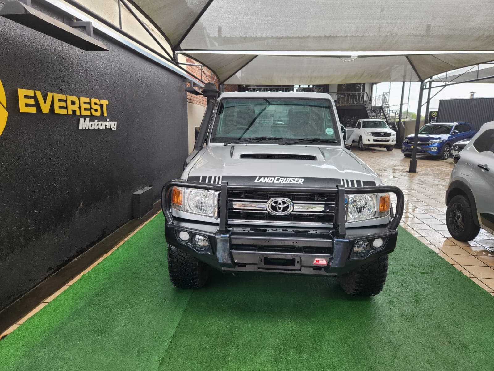 Frontal exterior view of the silver 2019 Toyota Land Cruiser 79 4.5 D Single-Cab with heavy-duty bull bar.