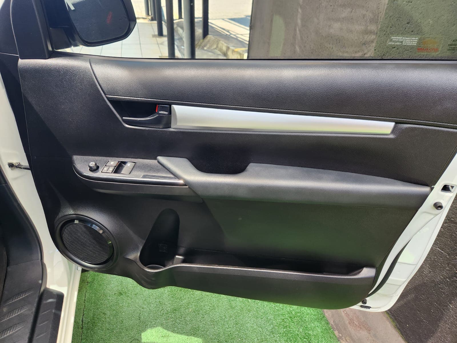 Driver and passenger leather seats in the cabin of the 2025 Toyota Hilux 2.4 GD Single-Cab.